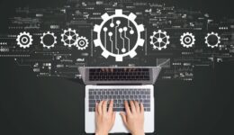 Automation concept with person using laptop