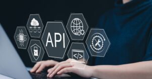 API Application Programming Interface Concept. A person types on laptop, with digital icons representing API development, security, and cloud computing technology. networking application software tool API Application Programming Interface Concept. A person types on laptop, with digital icons representing API development, security, and cloud computing technology. networking application software tool