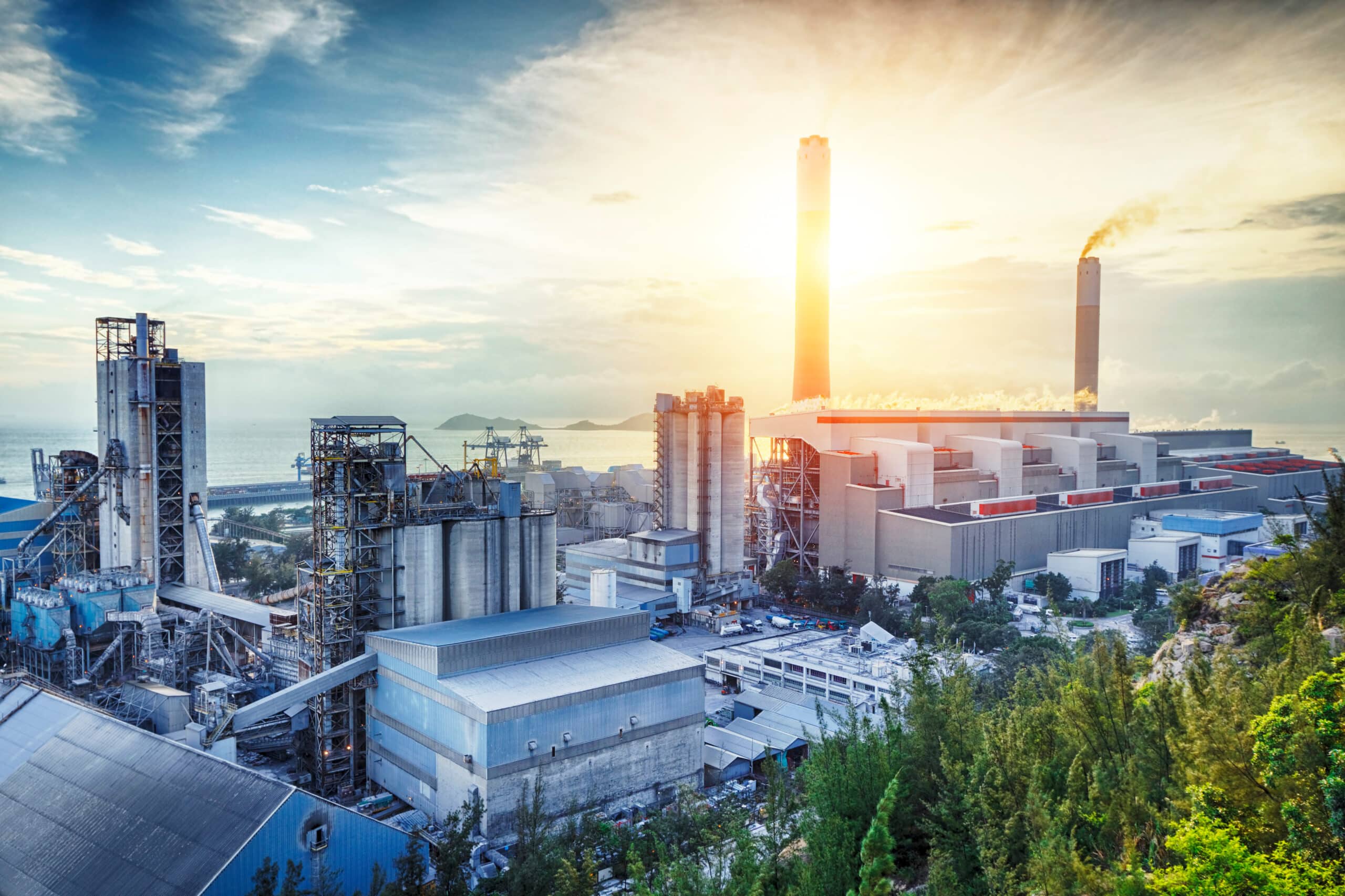 Glow light of petrochemical industry on sunset. Smart city interface showcasing emerging markets digital transformation with AI, automation, and cloud technology.